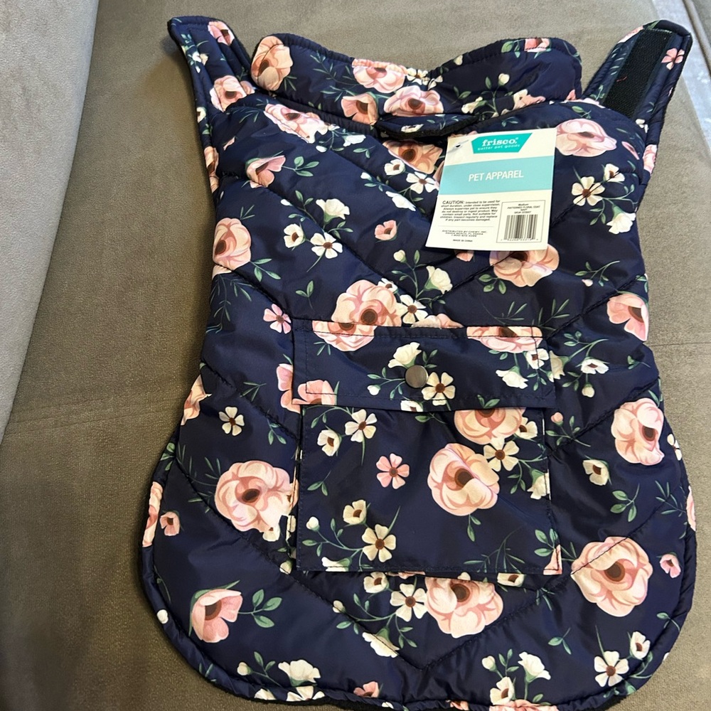 Waterproof pet apparel. Velcro closure around belly.
